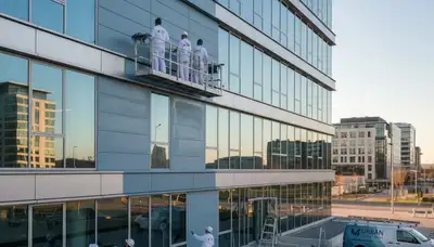 Professional commercial painters working on office exterior in Grand Rapids, MI